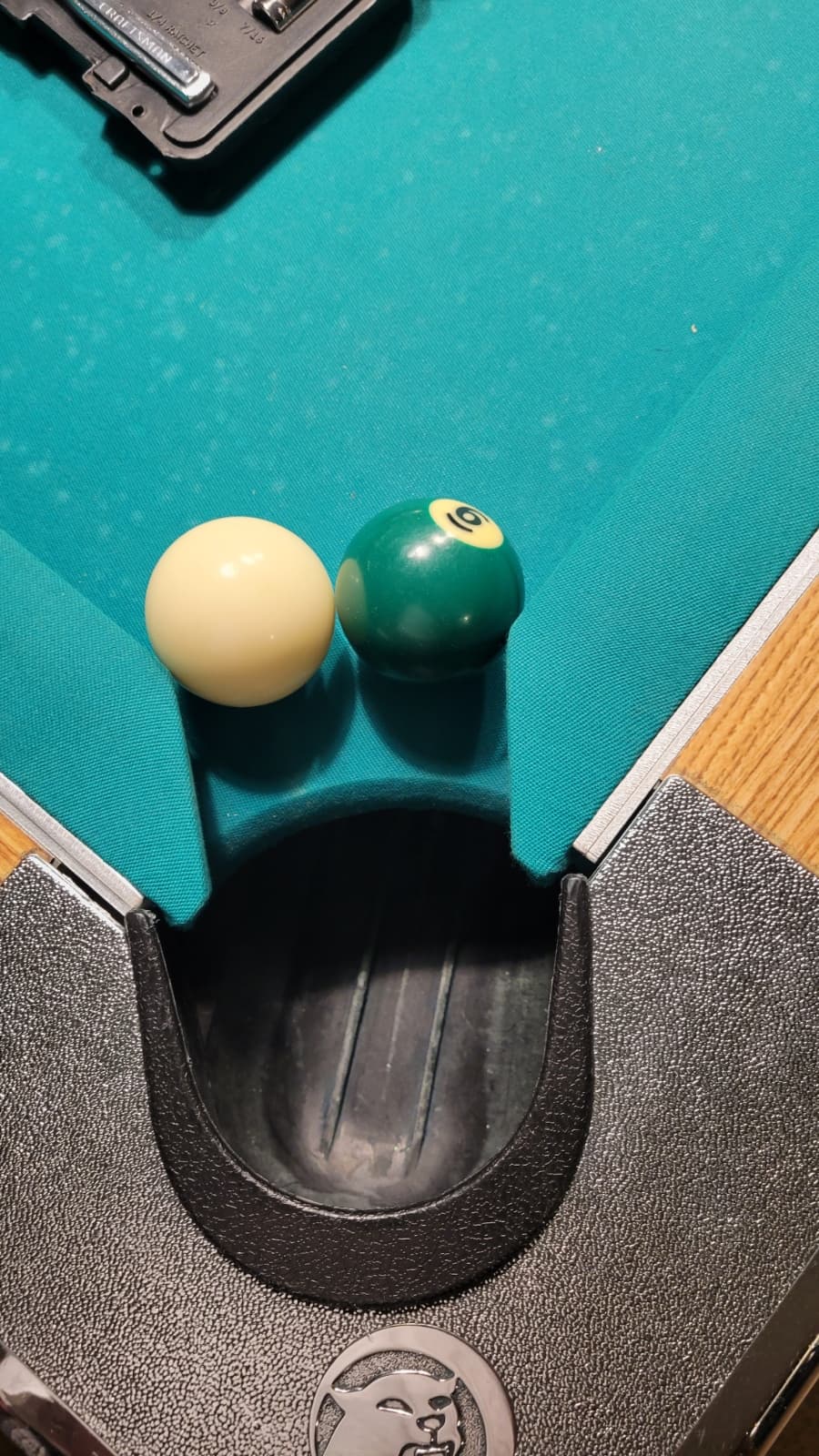 Tight pocket demonstration - balls at pocket edge showing reduced pocket size