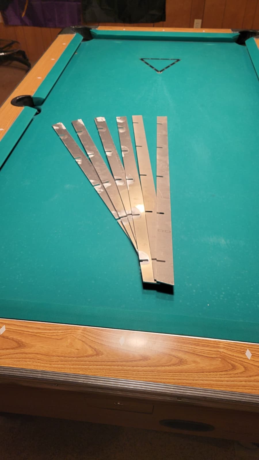 TruShim aluminum pocket shims displayed on Valley pool table